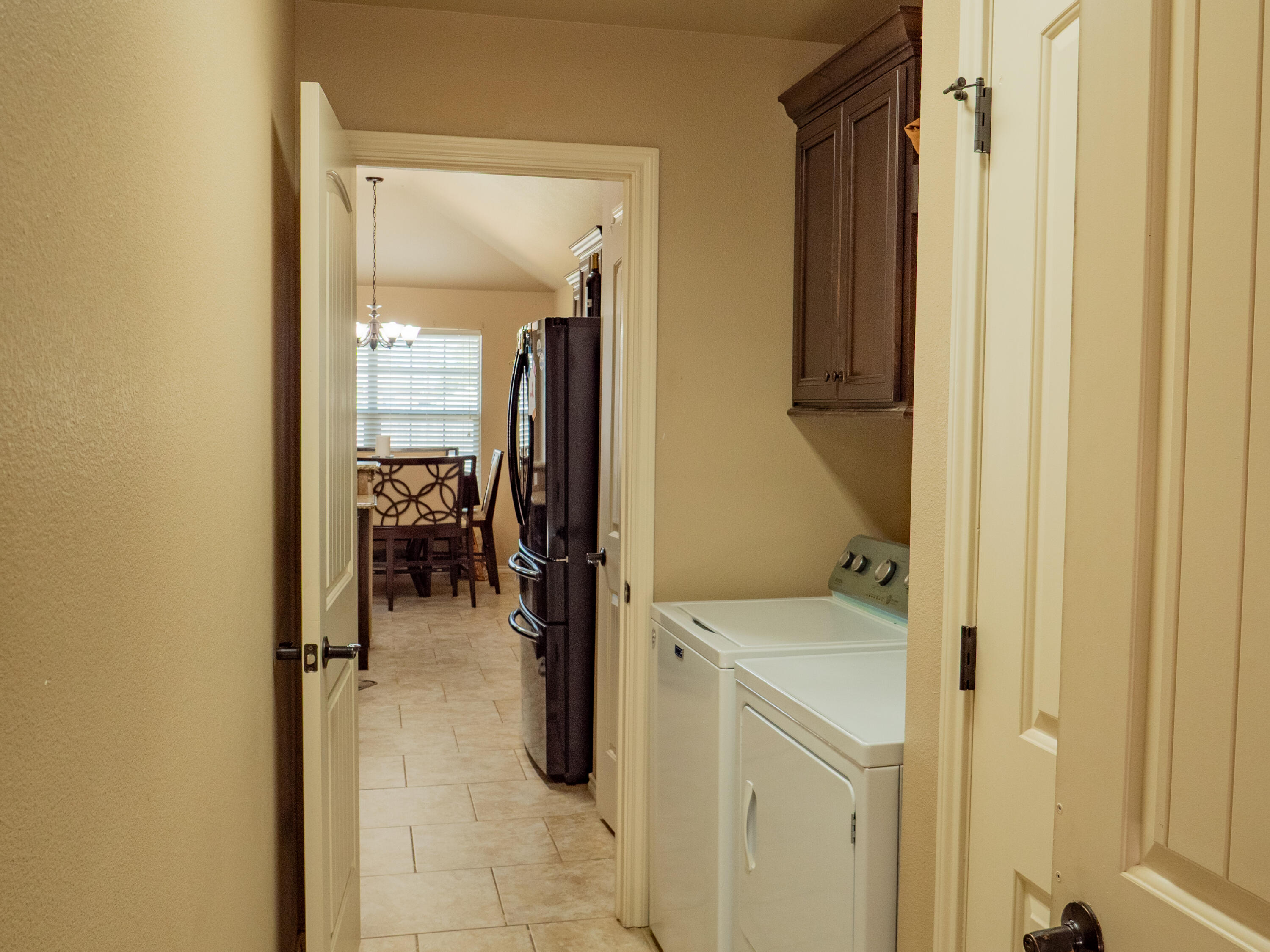 910 12th Street Wolfforth, TX 79382 - Photo 9 of 18 a utility room with closet dryer and washer