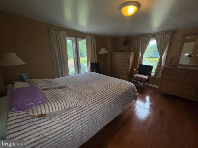 a view of a lake with houses in the back