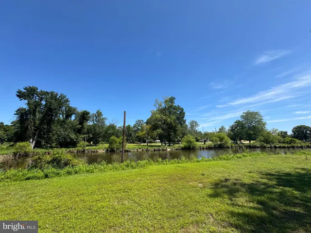 a view of a livingroom with furniture and an empty room