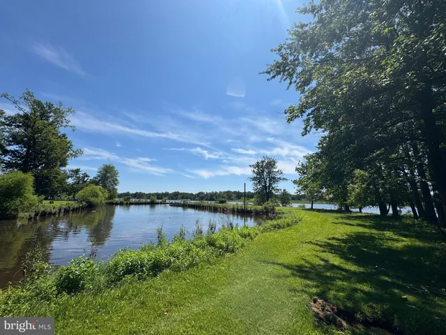 a kitchen with sink stove and cabinets
