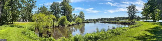 a kitchen with stainless steel appliances granite countertop a stove top oven a sink dishwasher and cabinets