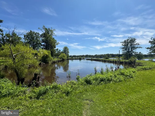 a view of a dining room with furniture and window