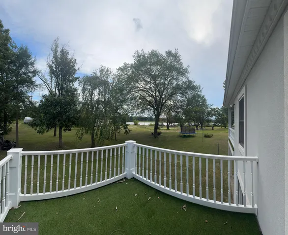 a view of a lake with a house in the background