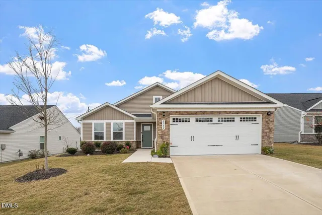 a view of a house with a yard and chandelier