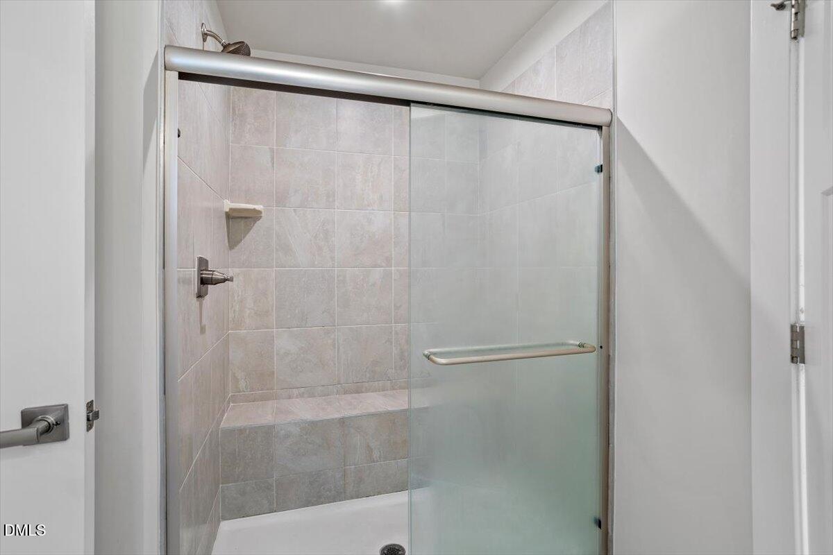 8588 Kenridge Lane Fuquay-Varina, NC 27526 - Photo 28 of 37 a bathroom with a shower