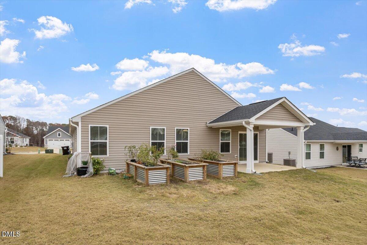 8588 Kenridge Lane Fuquay-Varina, NC 27526 - Photo 35 of 37 a house view with a garden space