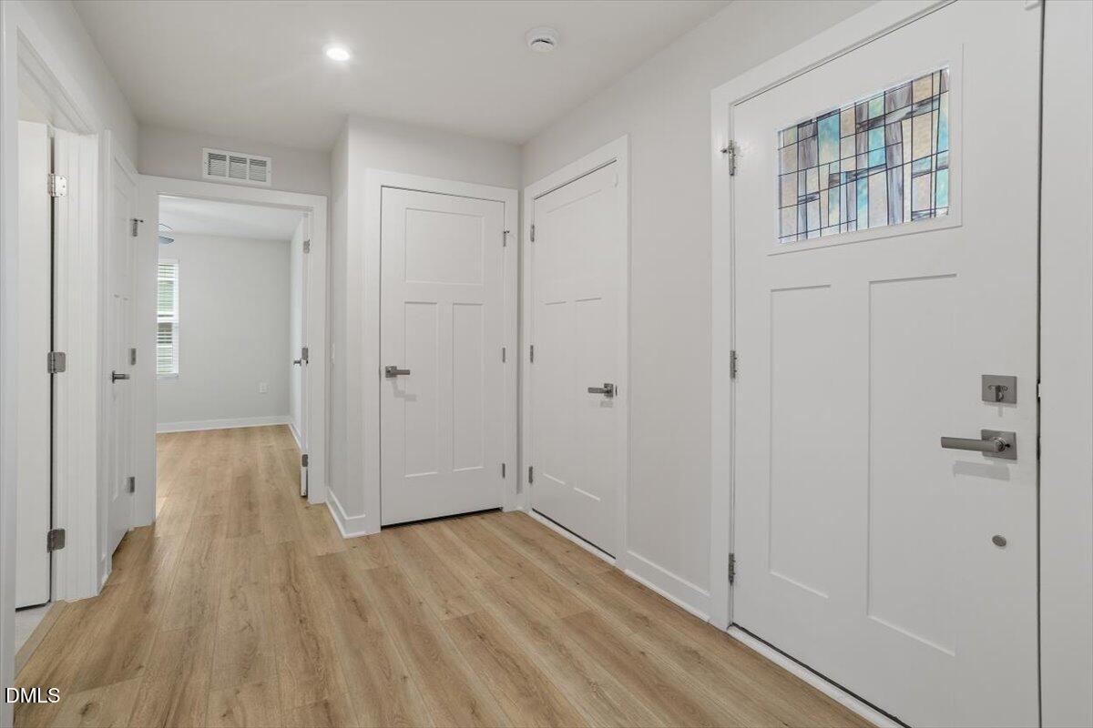 8588 Kenridge Lane Fuquay-Varina, NC 27526 - Photo 6 of 37 a view of a bathroom with wooden floor