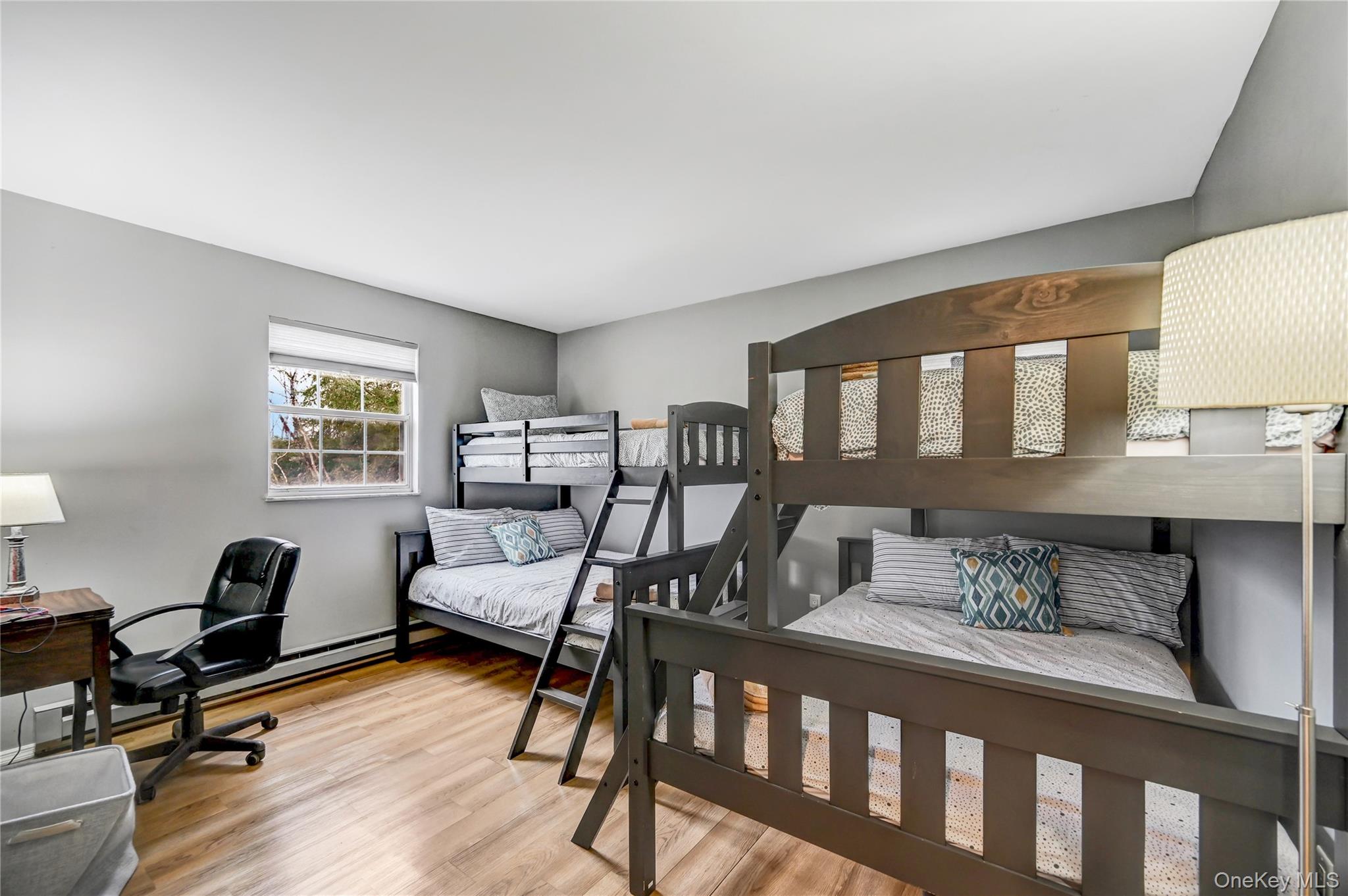 298 Learn Road Tannersville, PA 18372 - Photo 13 of 24 a bedroom with furniture and a wooden floor