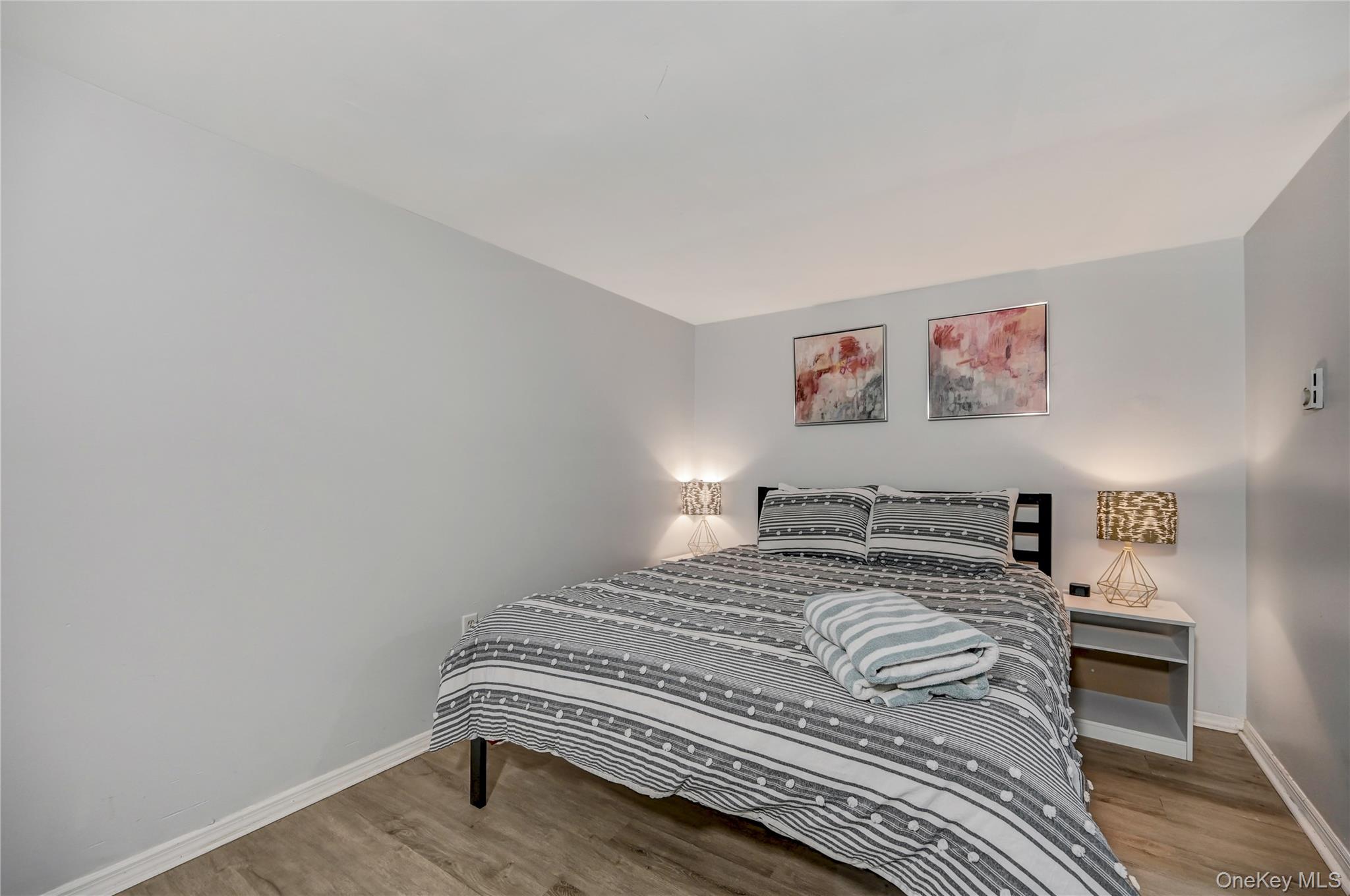 298 Learn Road Tannersville, PA 18372 - Photo 15 of 24 a bedroom with a bed and a wall painting