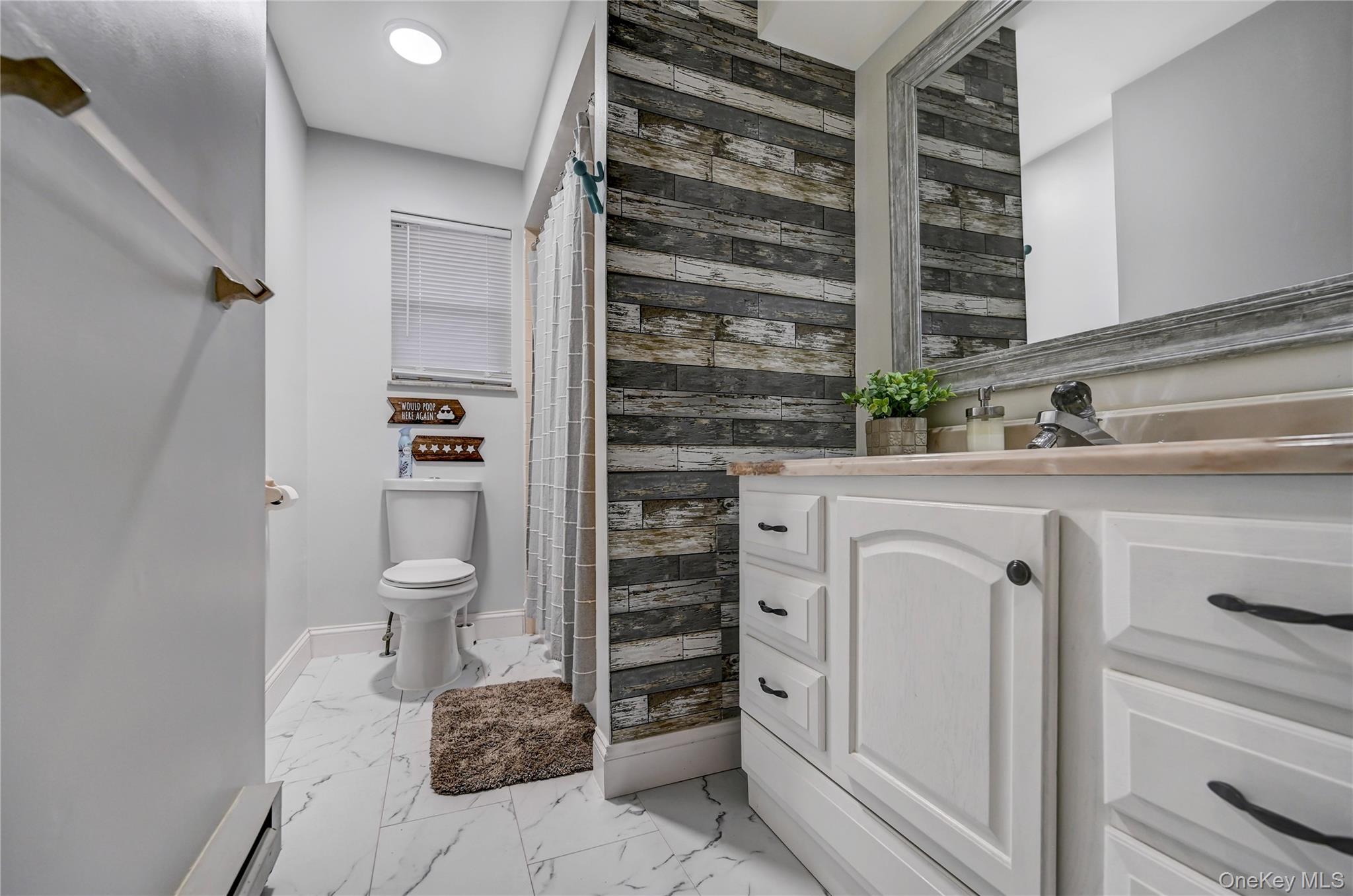 298 Learn Road Tannersville, PA 18372 - Photo 20 of 24 a bathroom with a toilet sink and shower