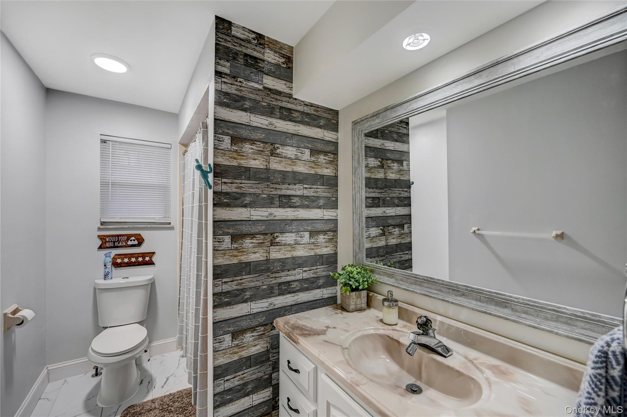 298 Learn Road Tannersville, PA 18372 - Photo 23 of 24 a bathroom with a sink toilet and shower