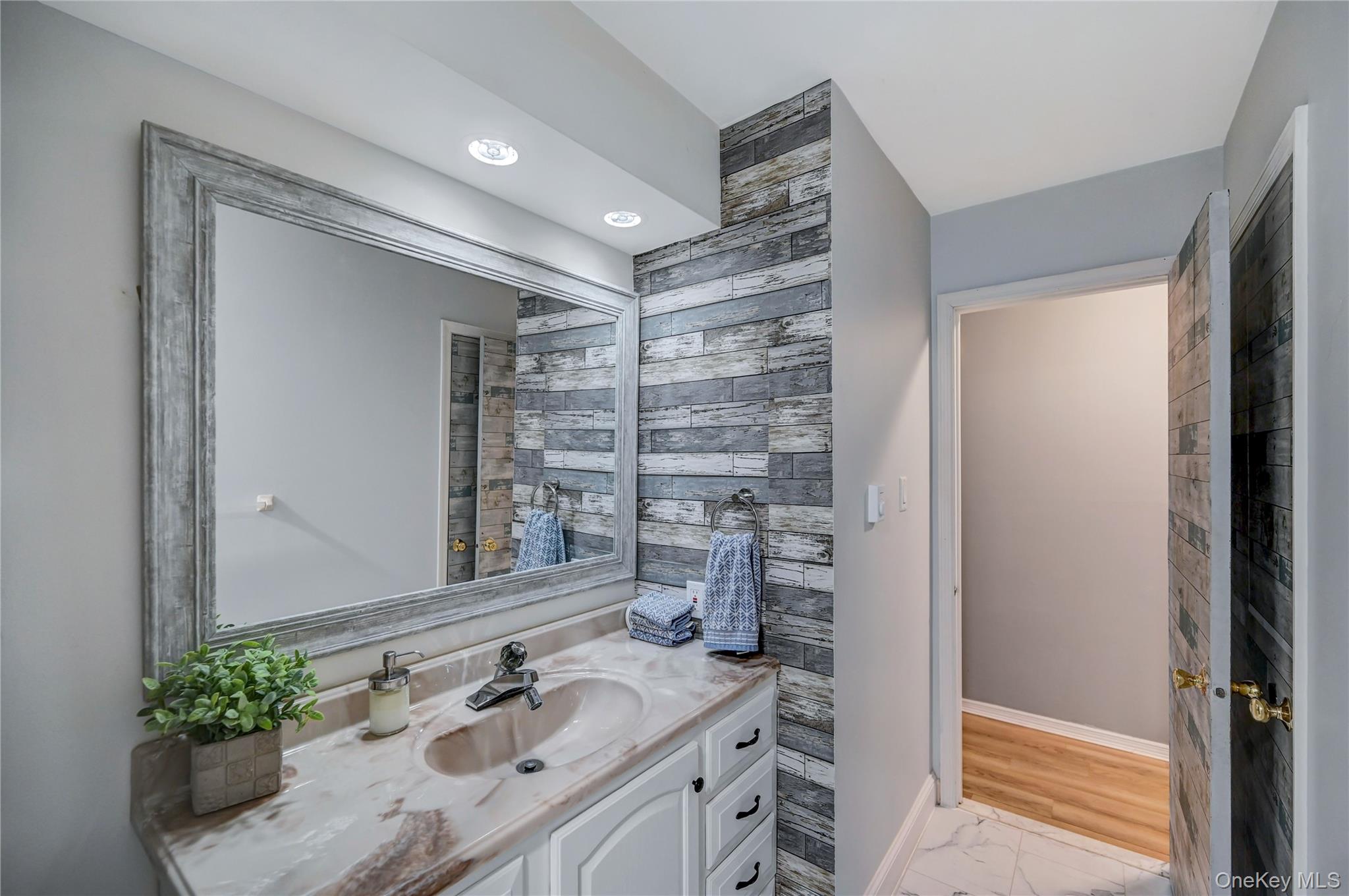 298 Learn Road Tannersville, PA 18372 - Photo 24 of 24 a bathroom with a sink and a mirror
