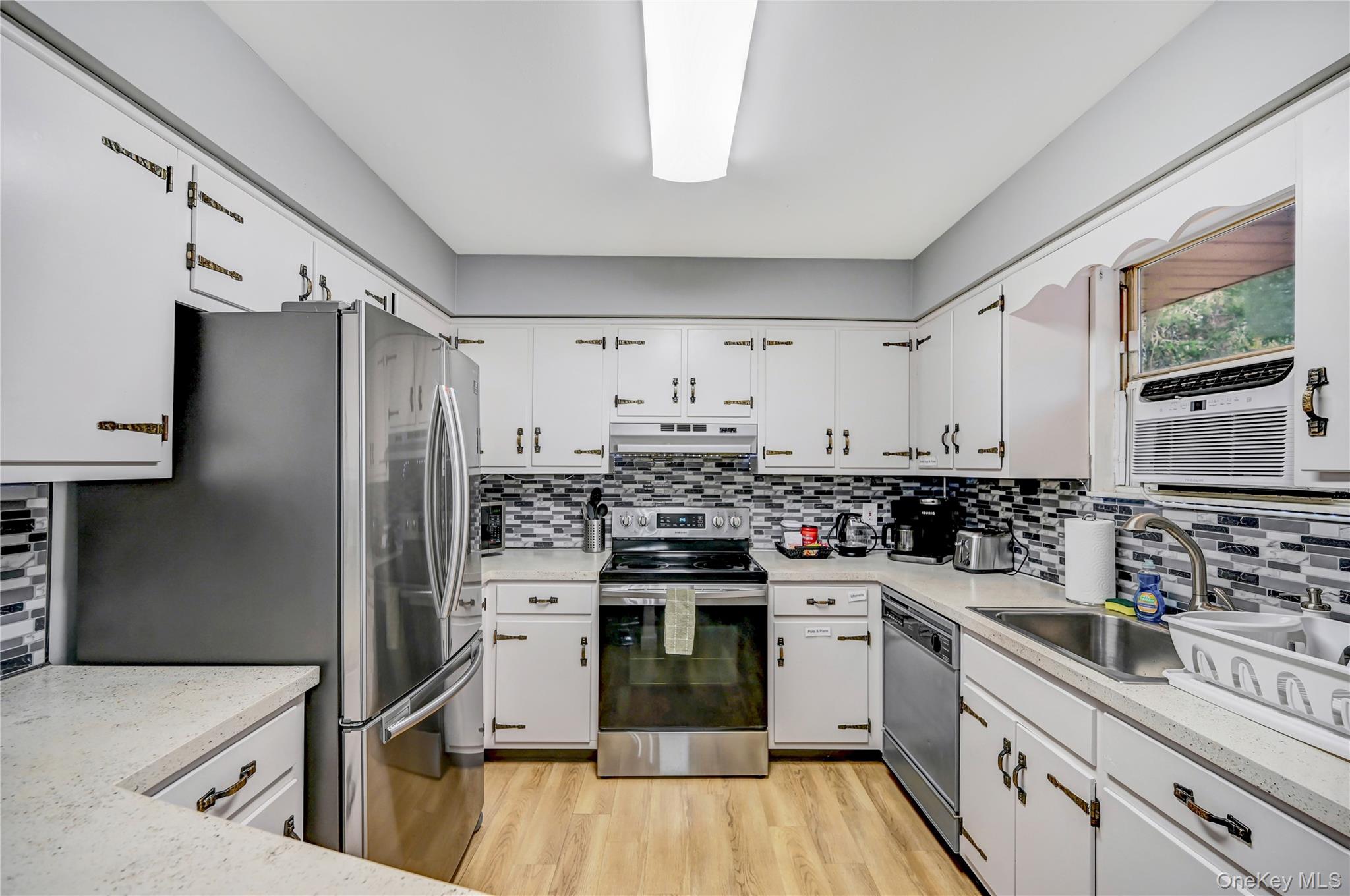 298 Learn Road Tannersville, PA 18372 - Photo 4 of 24 a kitchen with a stove a sink and a refrigerator