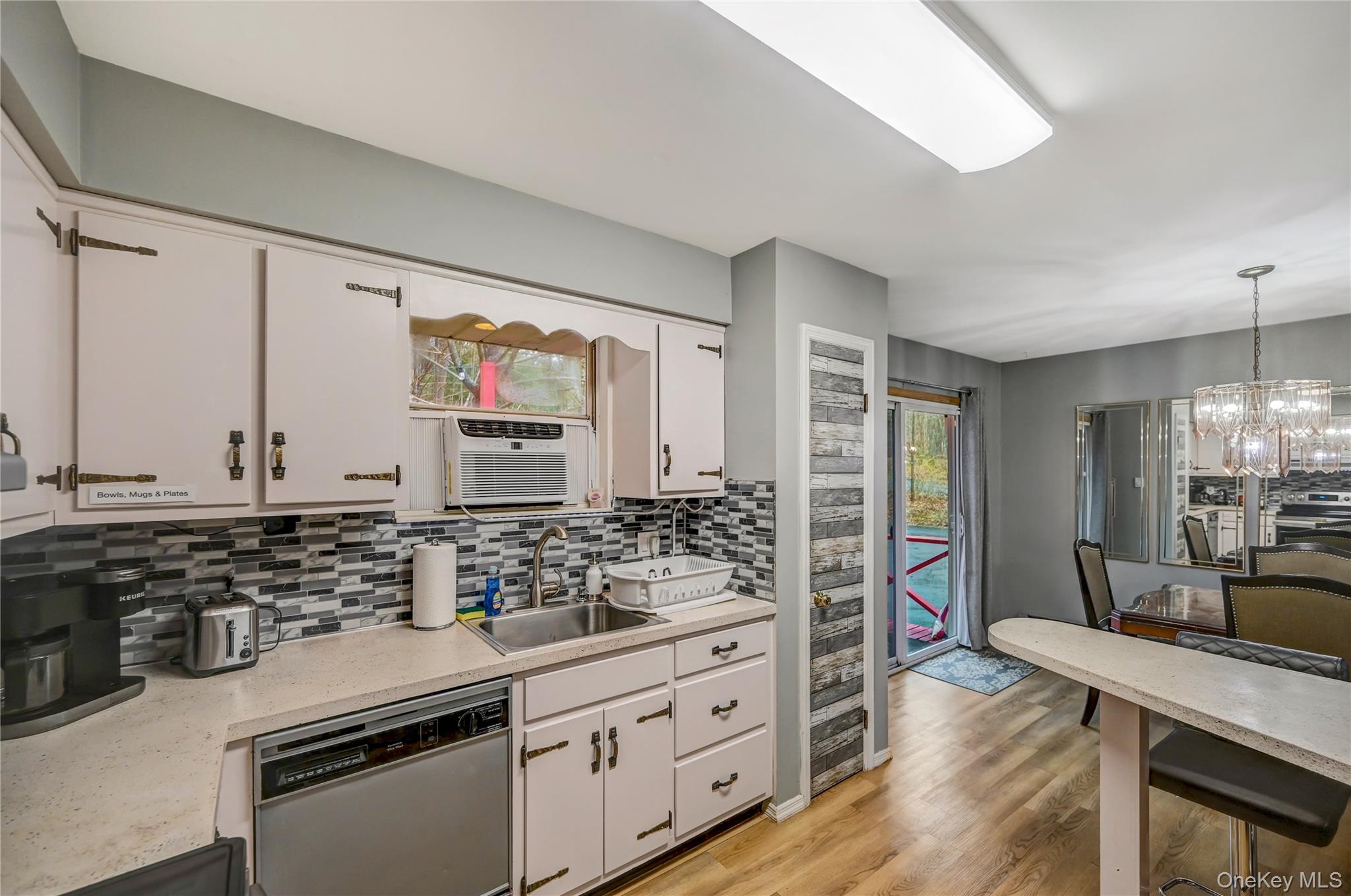 298 Learn Road Tannersville, PA 18372 - Photo 5 of 24 a kitchen with stainless steel appliances kitchen island granite countertop a sink stove and wooden cabinets