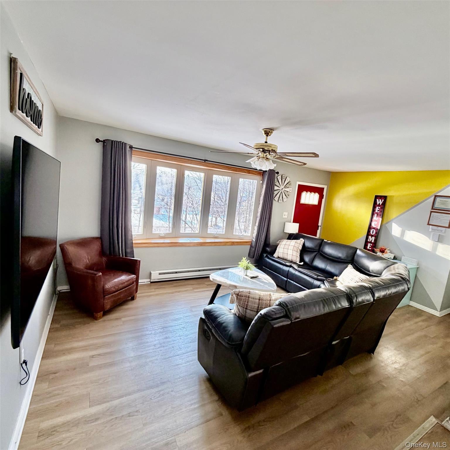 298 Learn Road Tannersville, PA 18372 - Photo 10 of 24 a living room with furniture and a flat screen tv