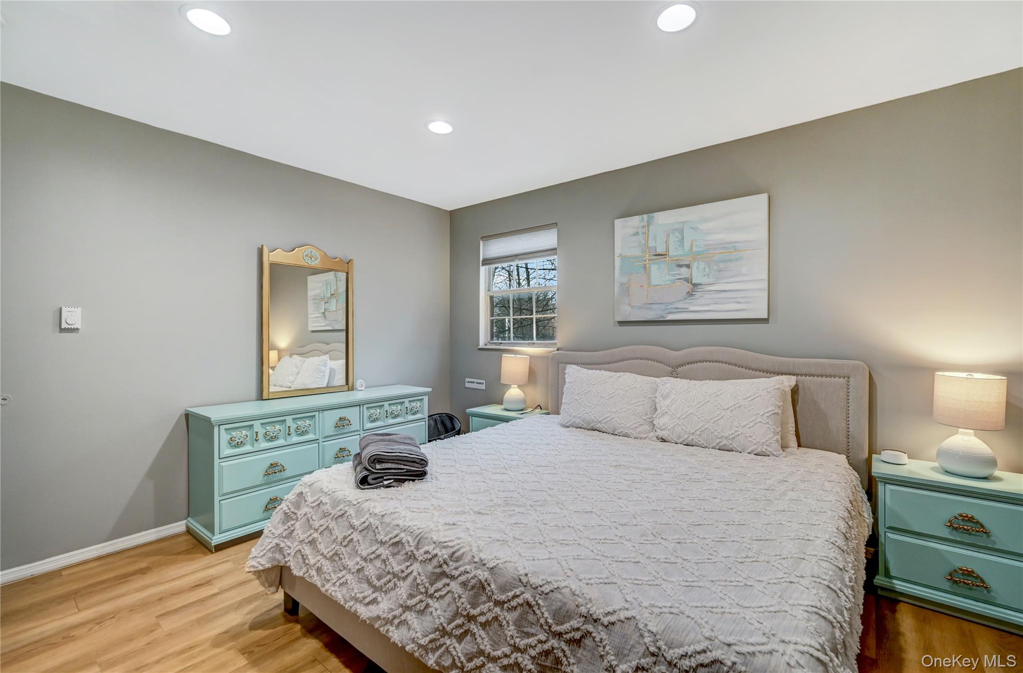 298 Learn Road Tannersville, PA 18372 - Photo 10 of 24 a bedroom with a bed a dresser with wooden floor