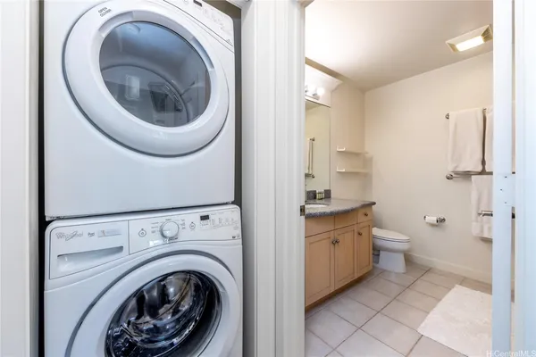 a spacious bathroom with a toilet and a sink