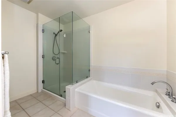 a bathroom with a bathtub and shower