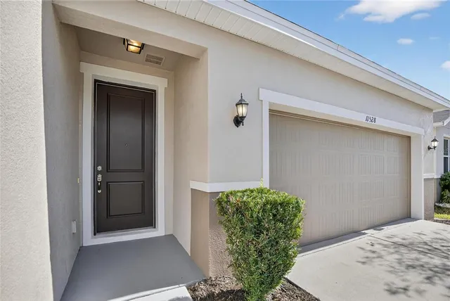 a view of a hallway to rooms