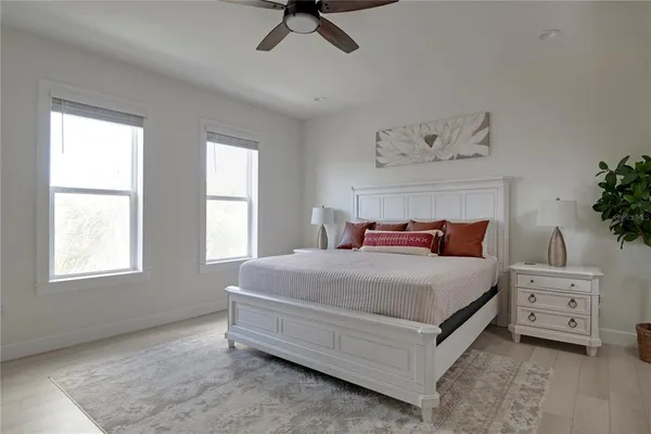 a bedroom with a bed and a dresser