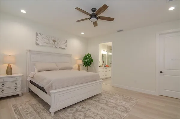 a room with a television and a dresser