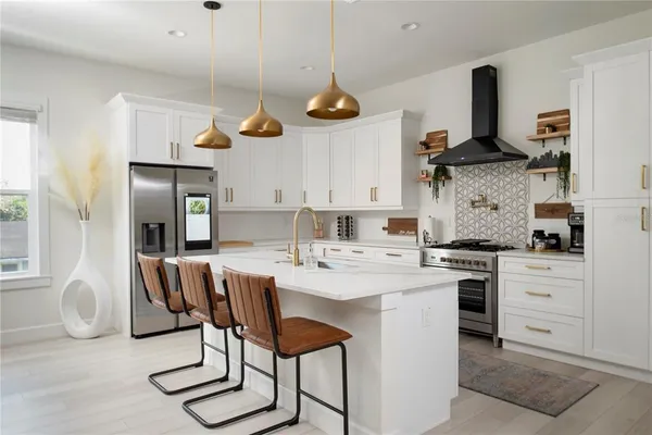 a kitchen with a stove and cabinets