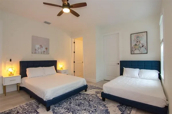 a bedroom with a bed and a couch