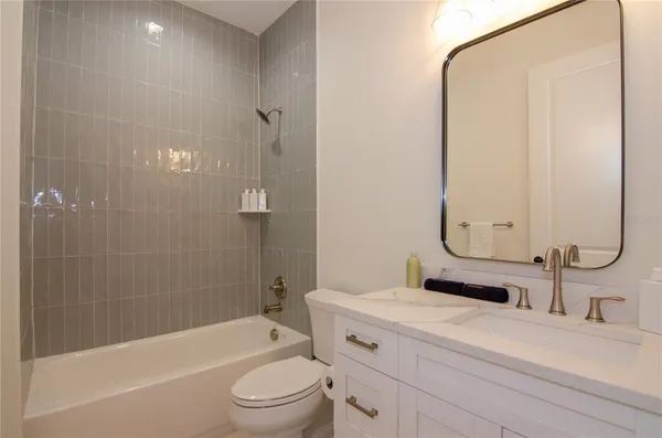 a bedroom with bed and a window