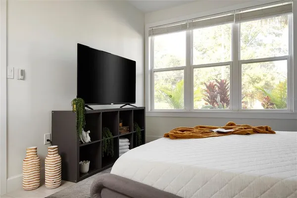 a bathroom with a toilet a sink and a mirror