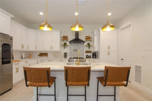 a table with a vase and flowers on it