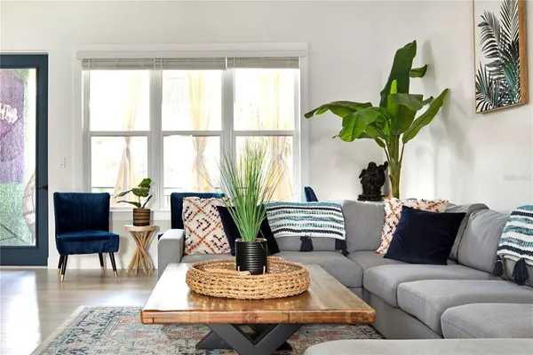 a living room with furniture and a window