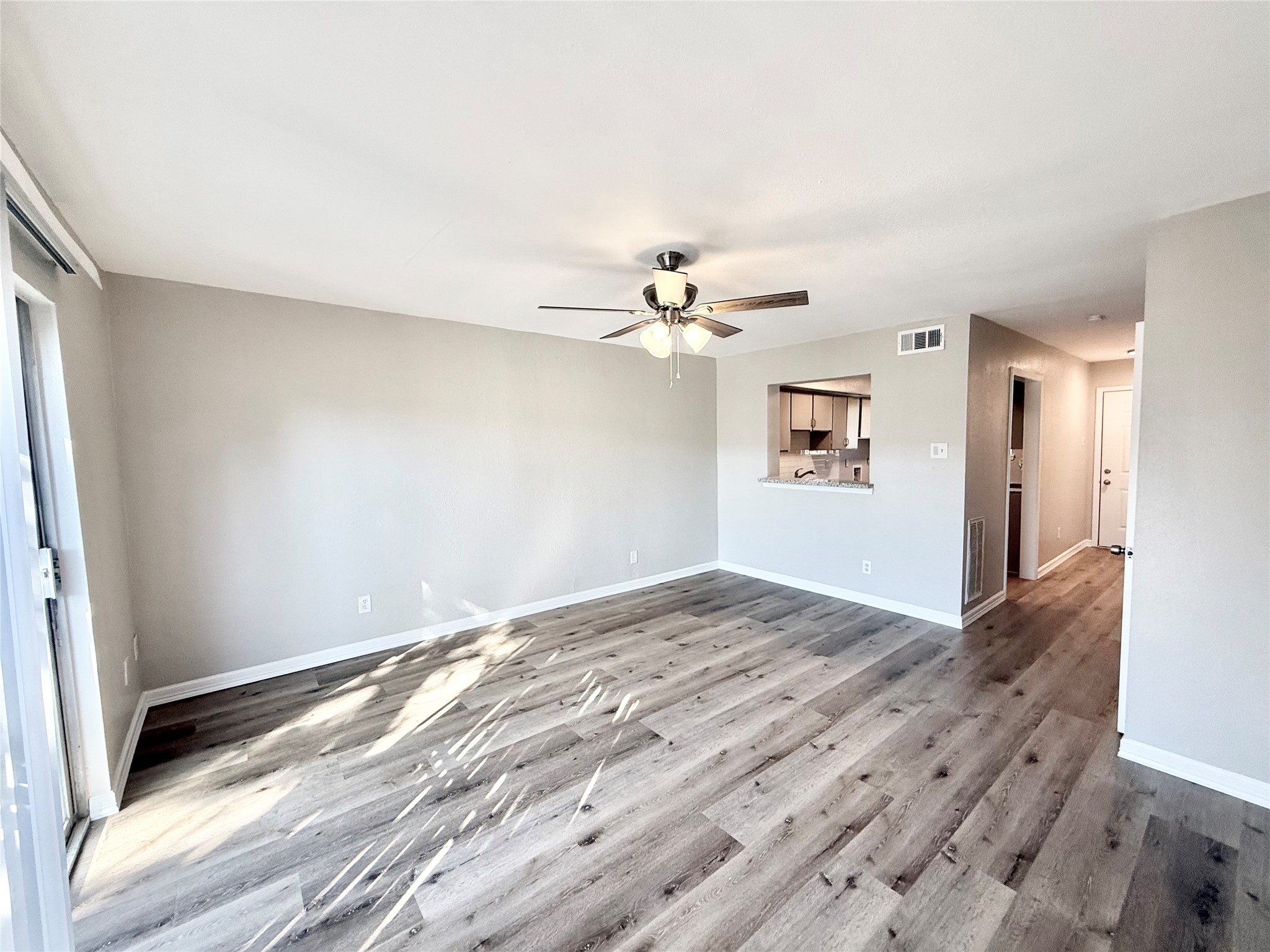 7980 Grove Ridge Drive Houston, TX 77061 - Photo 9 of 19 From Living/Dining, a peek into the Kitchen for easy hosting