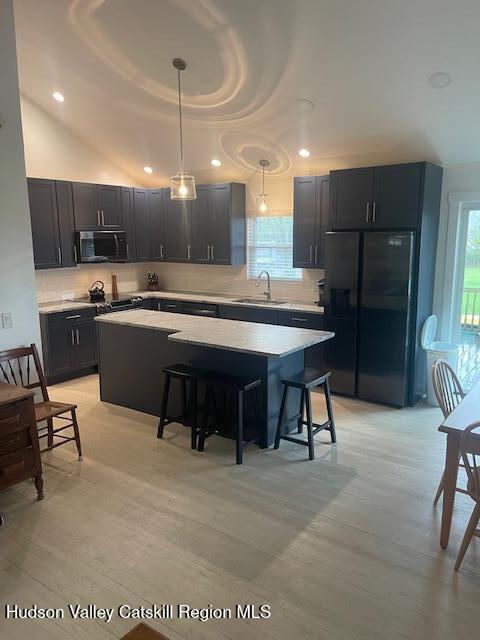 9580 Rte 9W Athens, NY 12015 - Photo 14 of 35 a kitchen with kitchen island a stove a table and chairs in it