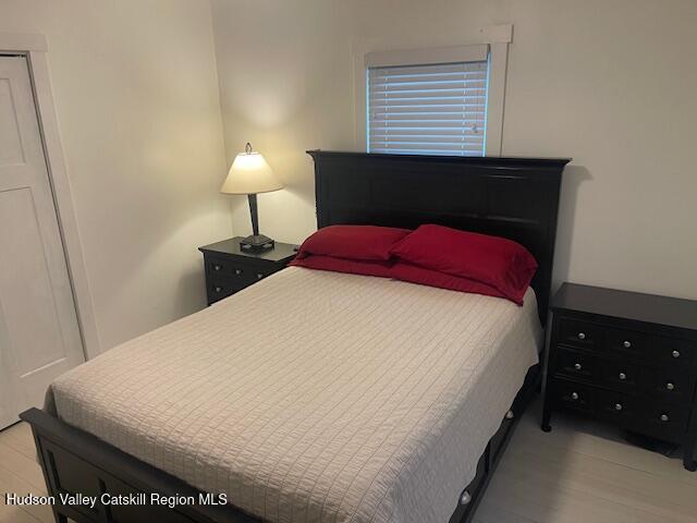 9580 Rte 9W Athens, NY 12015 - Photo 19 of 35 a bedroom with a bed and a lamp