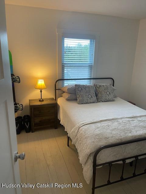 9580 Rte 9W Athens, NY 12015 - Photo 23 of 35 a bed sitting in a bedroom next to a window