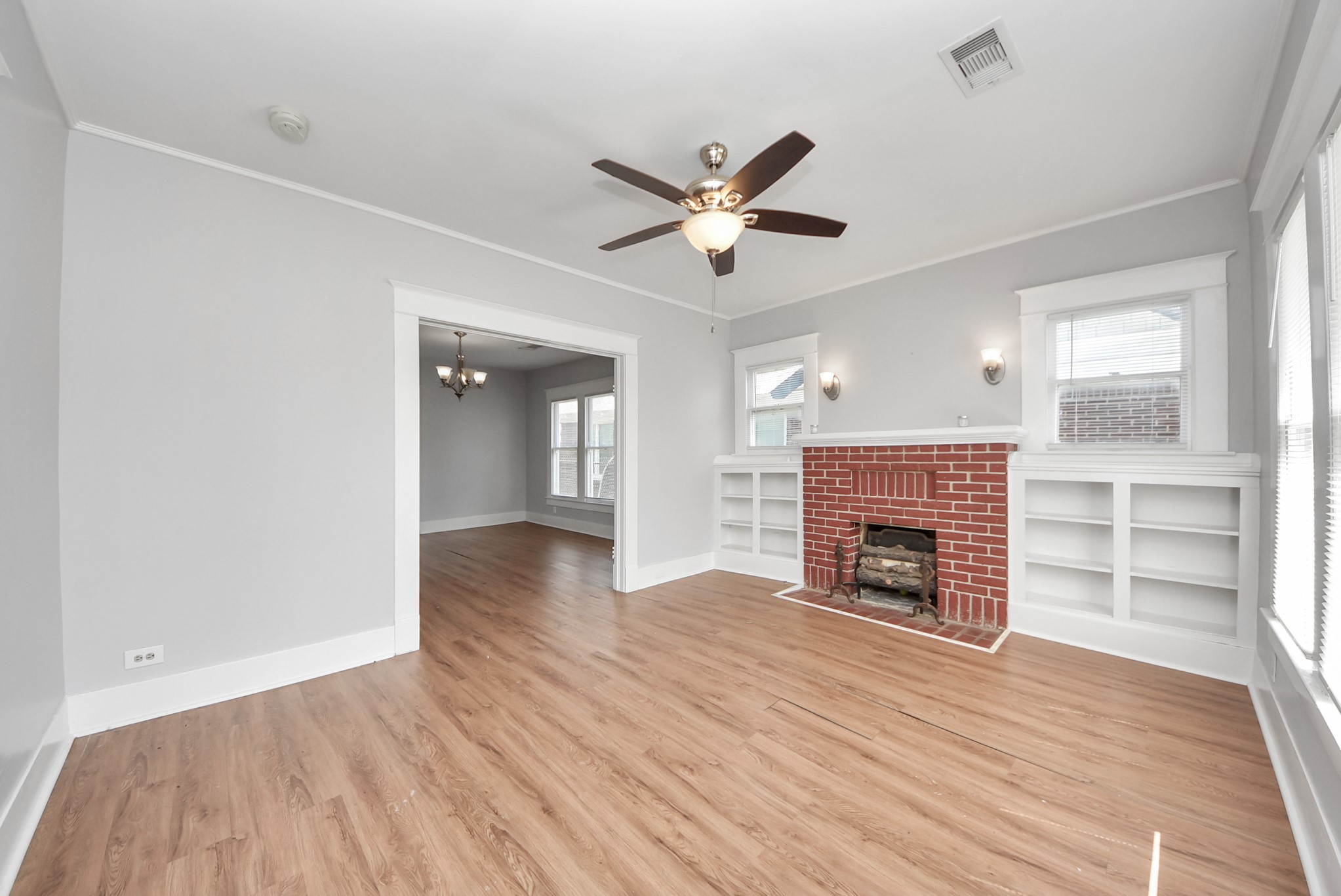 6 Jenkins Street Houston, TX 77003 - Photo 14 of 42 Spacious living area featuring vinyl plank flooring, Structural floor movement is suspected; flooring yields under weight