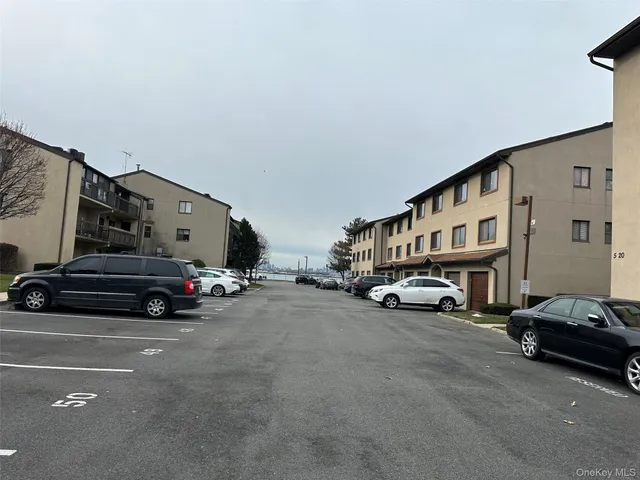 a view of car parked in front of a house