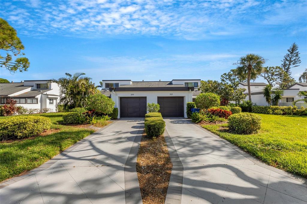 a view of a fountain in front of a house