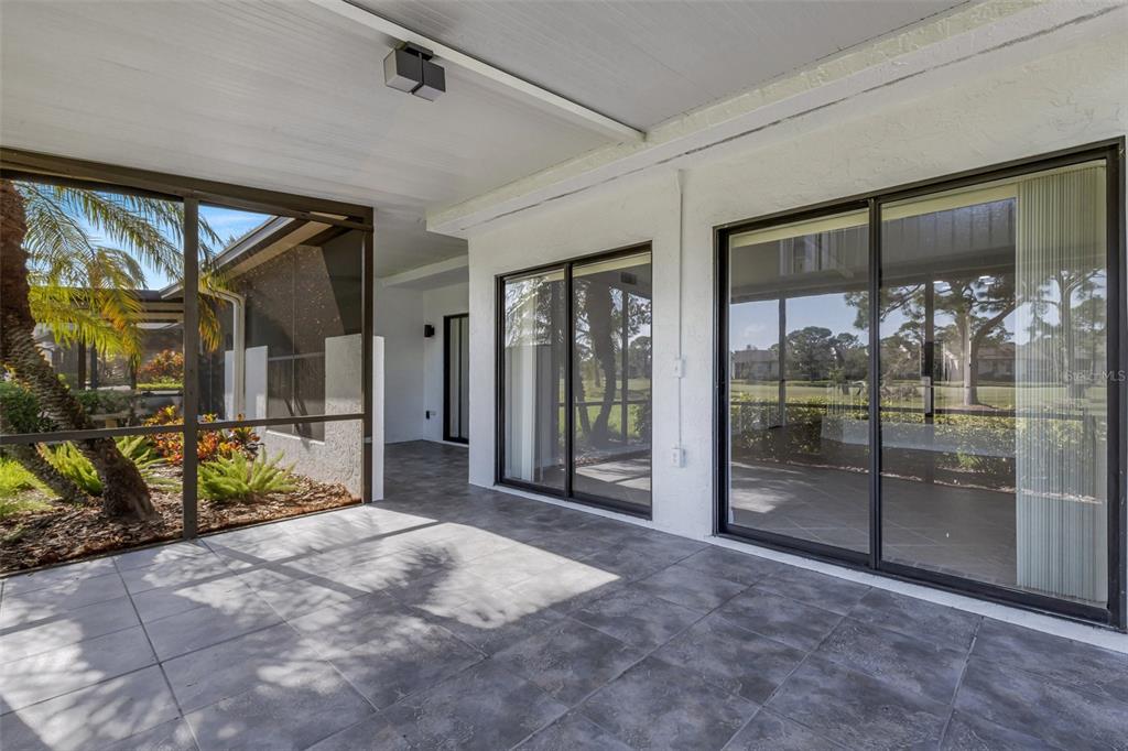 3119 Heatherwood Lane Sarasota, FL 34235 - Photo 30 of 47 a spacious en suite bathroom with a glass door