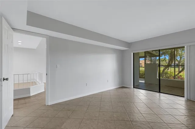 a view of an empty room with glass door