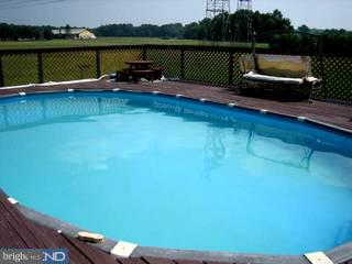 45 Maskells Mill Road Salem, NJ 08079 - Photo 3 of 6 a view of a lake with couches chairs and a yard