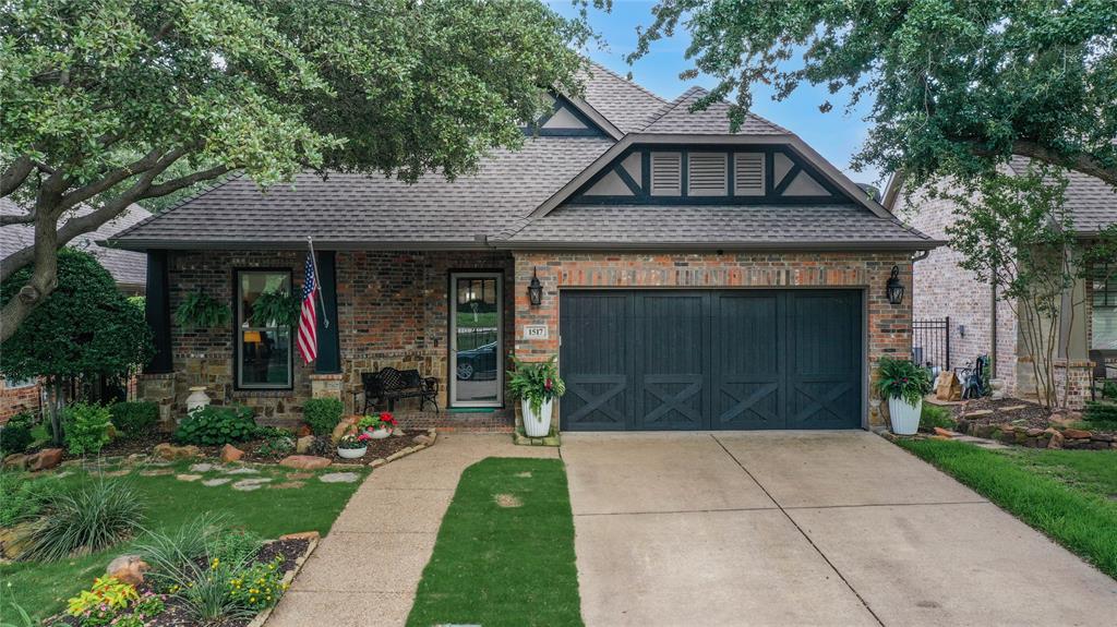 1517 Milsap Road McKinney, TX 75072 - Photo 1 of 1 a front view of a house with garden