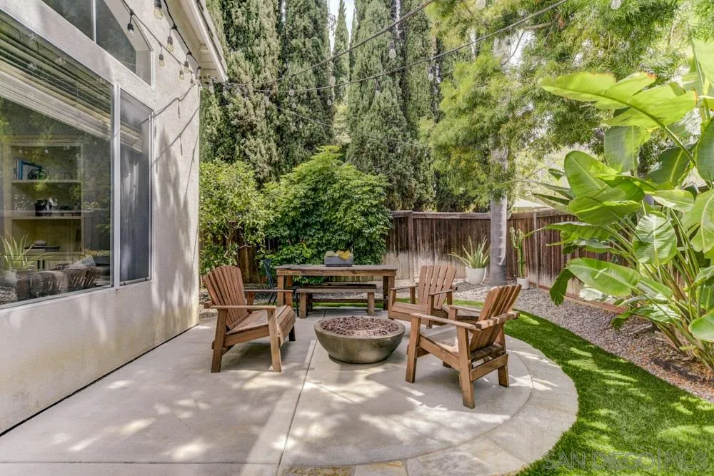 7730 Corte Marin Carlsbad, CA 92009 - Photo 21 of 26 a view of a patio with table and chairs and potted plants