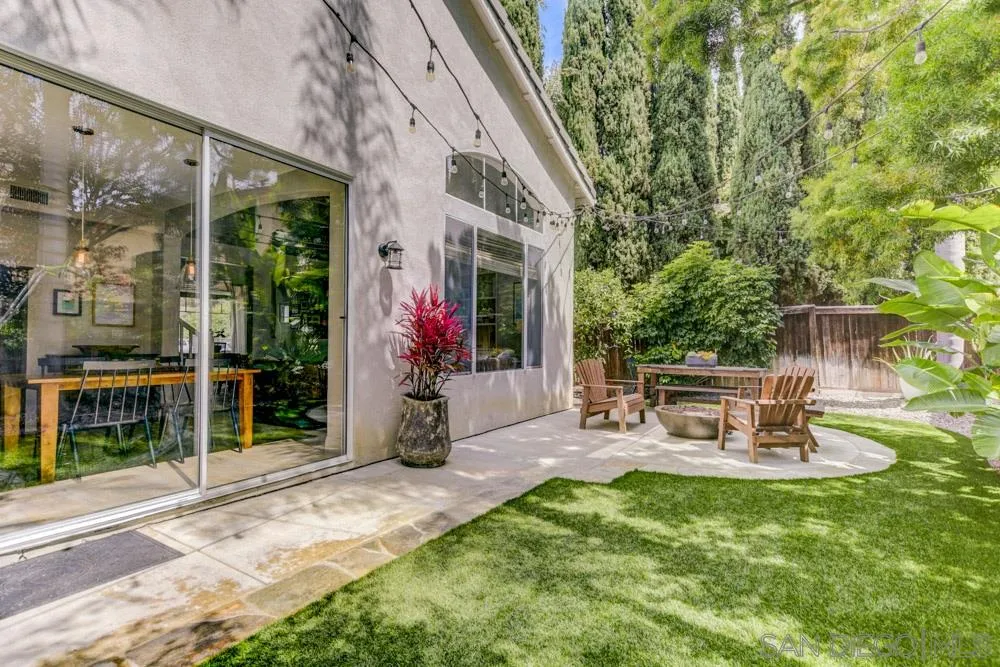 7730 Corte Marin Carlsbad, CA 92009 - Photo 24 of 26 a view of a chairs and table in backyard of the house