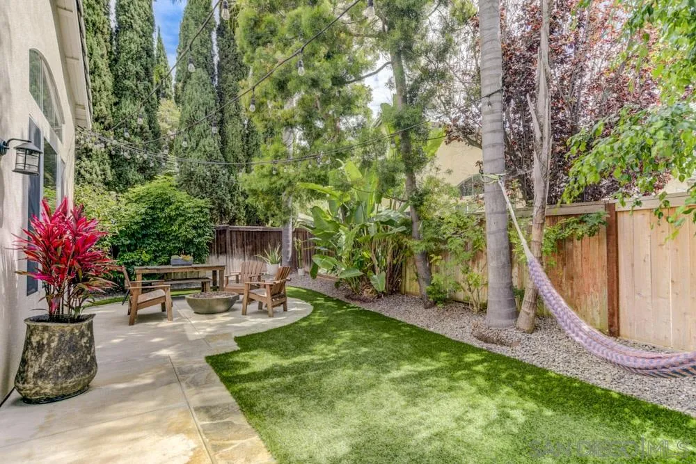 7730 Corte Marin Carlsbad, CA 92009 - Photo 3 of 26 a view of a chair and table in backyard of the house