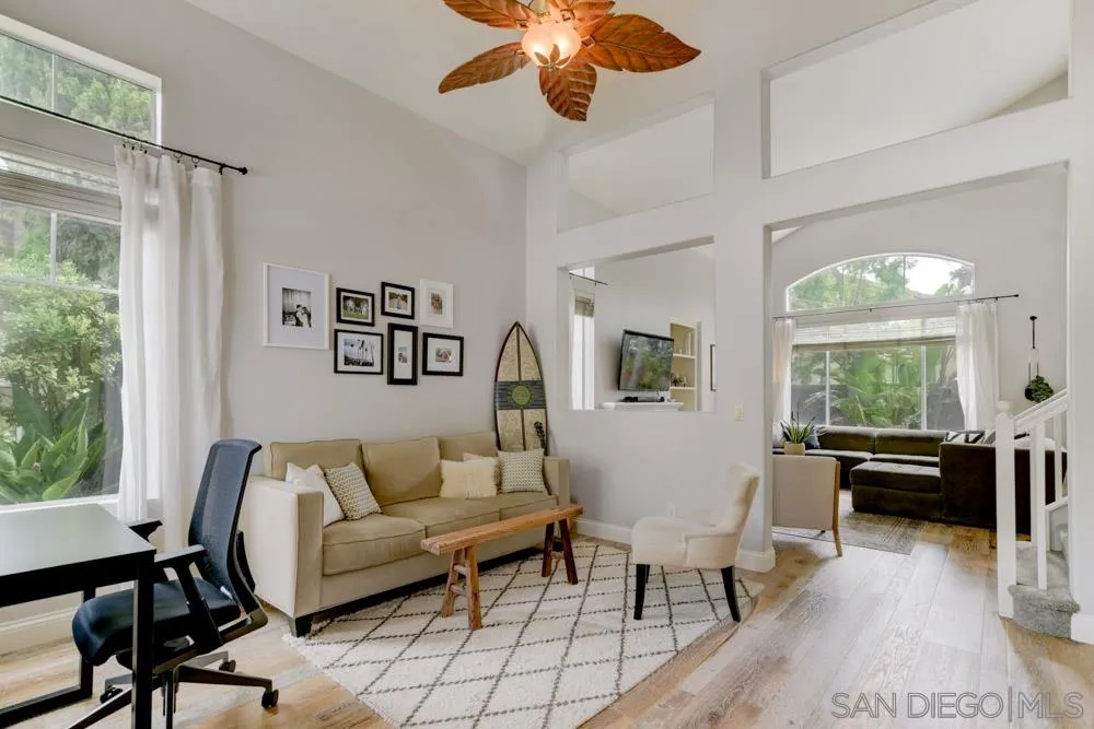 7730 Corte Marin Carlsbad, CA 92009 - Photo 6 of 26 a living room with furniture and a large window