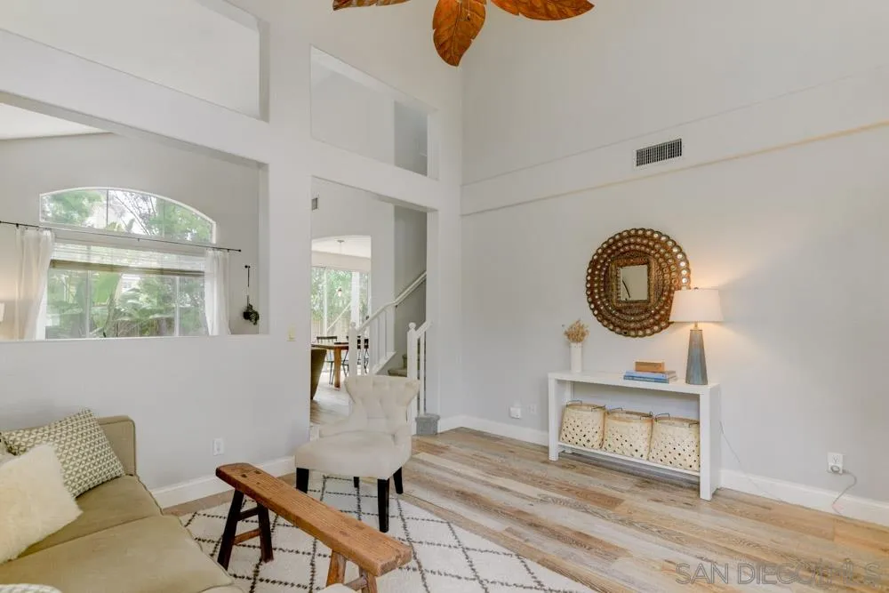 7730 Corte Marin Carlsbad, CA 92009 - Photo 7 of 26 a living room with furniture and a window