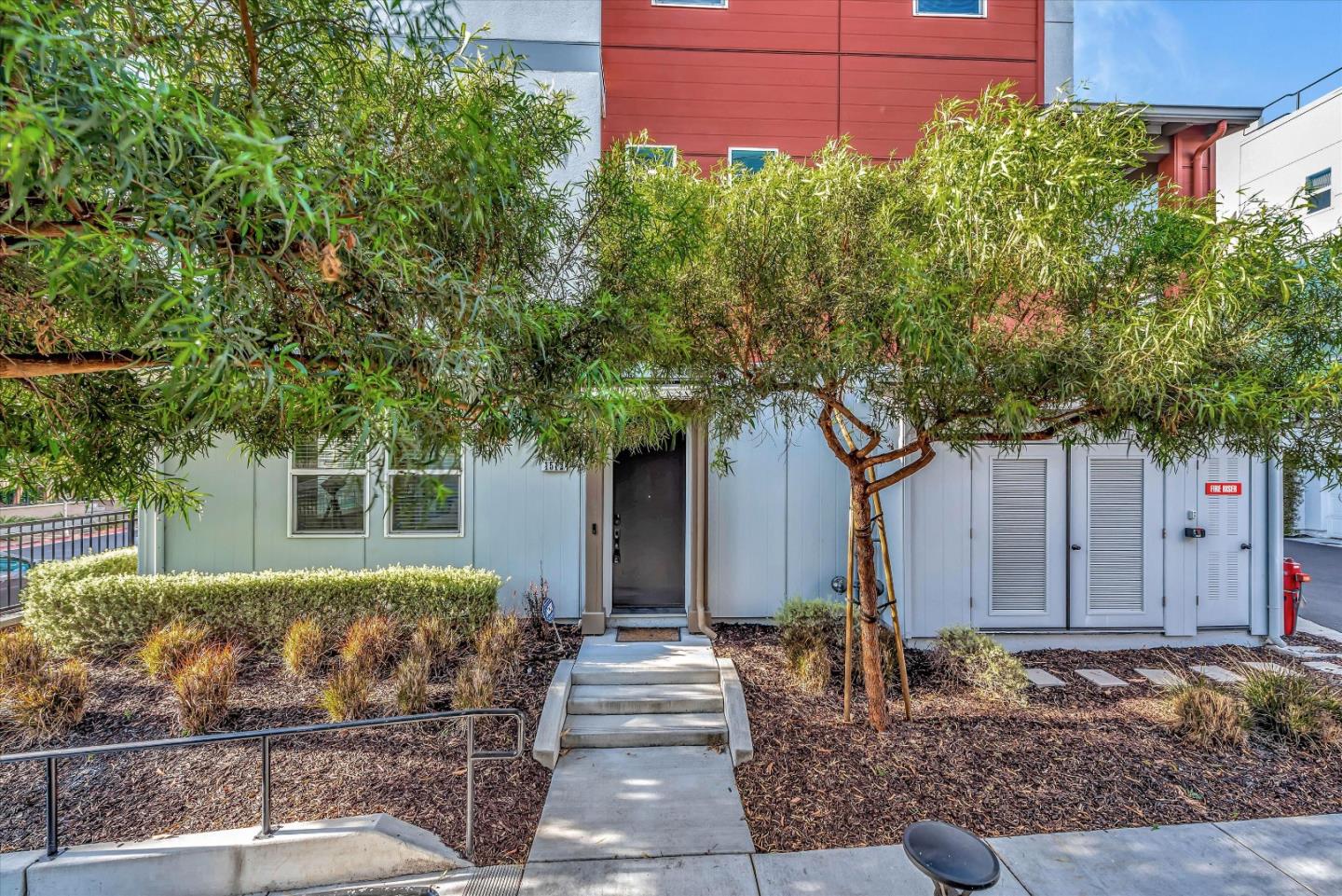 a front view of a house with garden