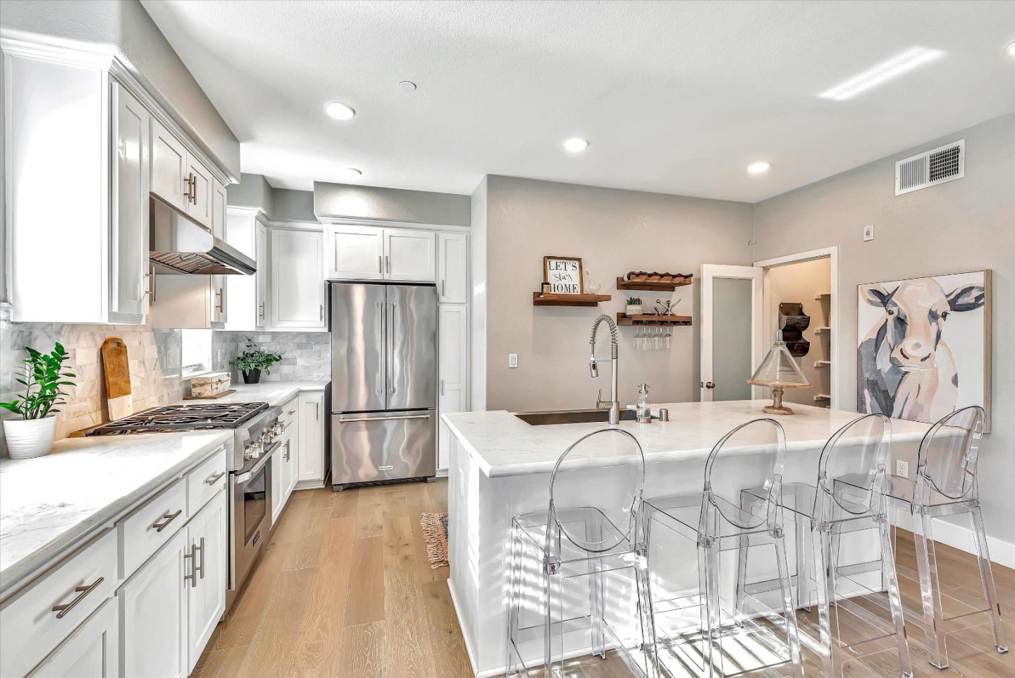 1512 Bond Street Milpitas, CA 95035 - Photo 17 of 49 a kitchen with refrigerator and cabinets