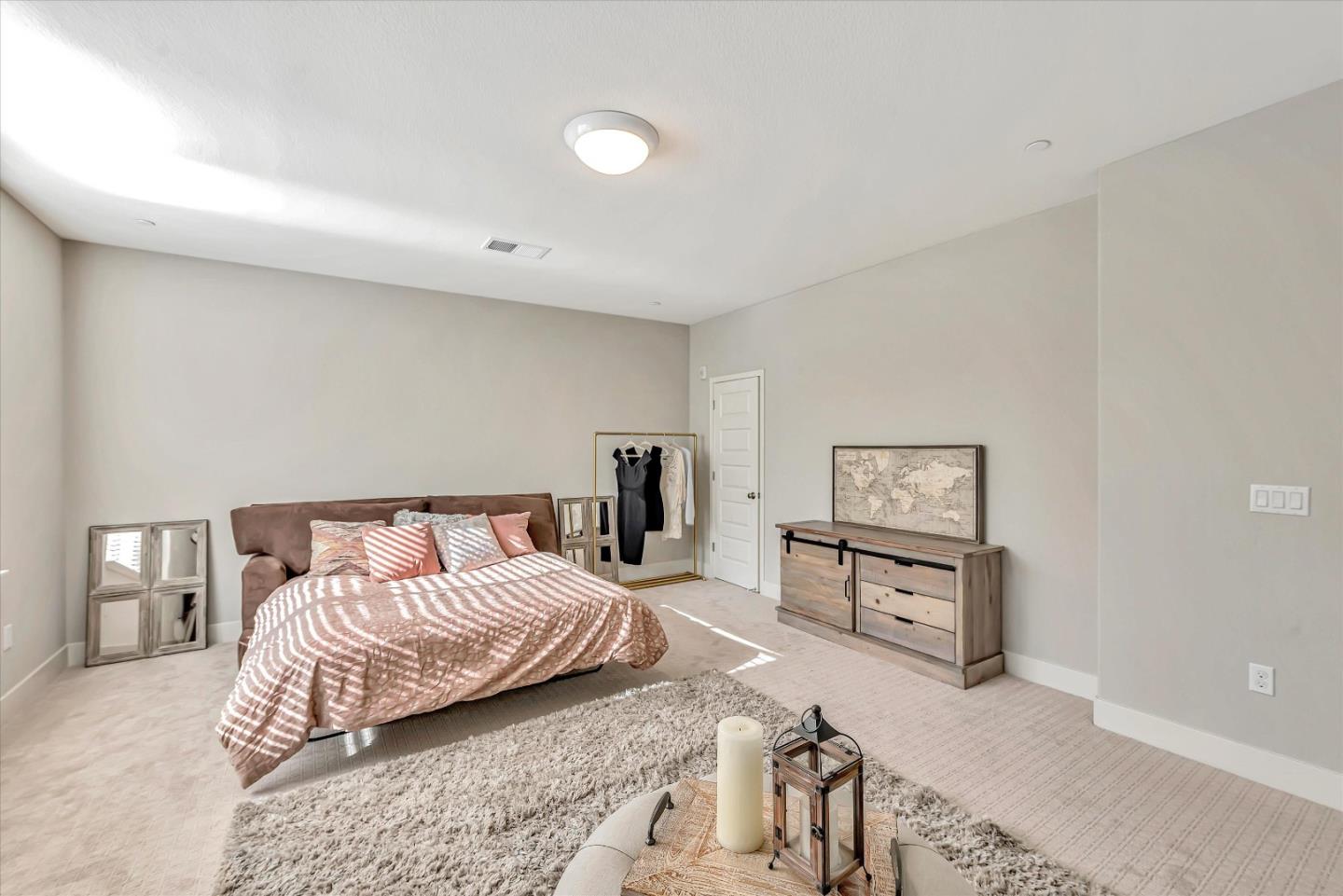 1512 Bond Street Milpitas, CA 95035 - Photo 23 of 49 a bedroom with a bed and a dresser with mirror